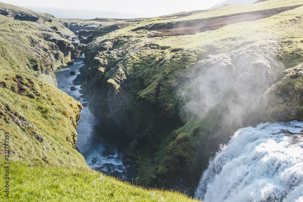 aerial view of waterfall on Skoga river flowing through highlands in Iceland