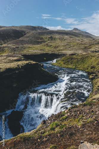 aerial view of beautiful Skora river flowing through highlands in Iceland