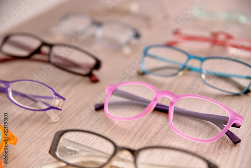 Assortment of glasses on table in an eyewear store