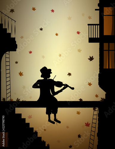 autumn melody, colored leaves falling and poor boy plays violine in the old town,