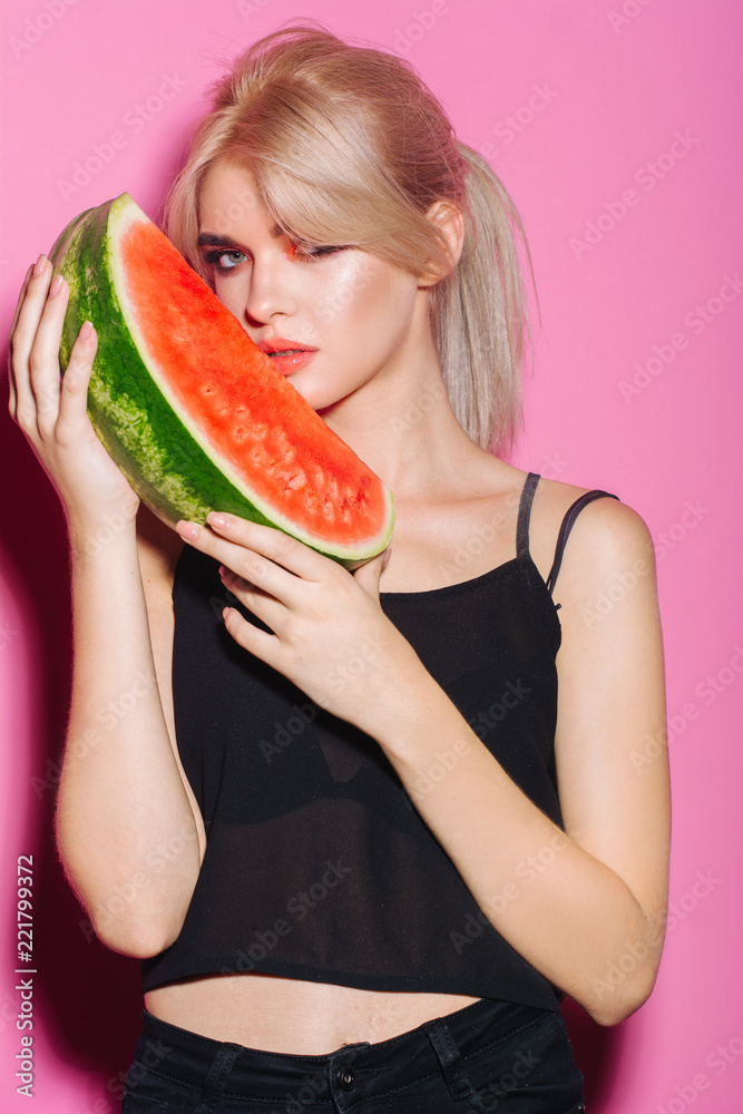 portrait happy young woman is holding slice of watermelon. Taste of watermelon. Summer. Fruits. portrait happy young woman is holding slice of watermelon. Taste of watermelon. Summer. Fruits.