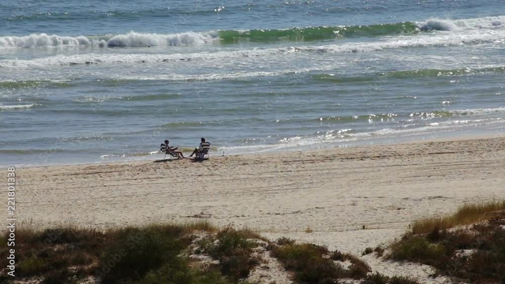 View of the sea beaches with vacationers people Portugal Algarve Tavira. View of the sea beaches with vacationers people Portugal Algarve Tavira.