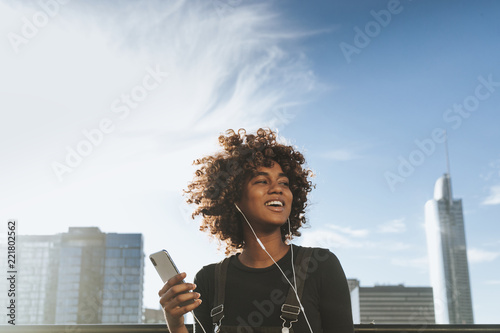 Girl listening to music from her phone