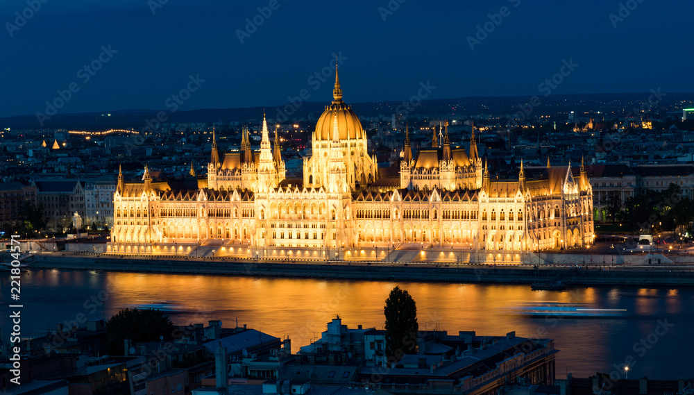 Hungarian Parliament in Budapest reflected in Danube river