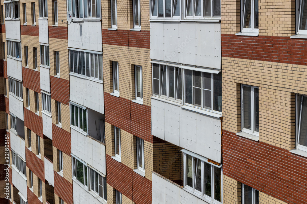 White balconies on the building of red brick White balconies on the building of red brick