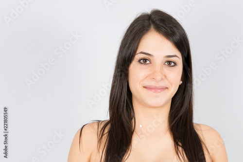 beauty young charming smiling woman close-up on a white background