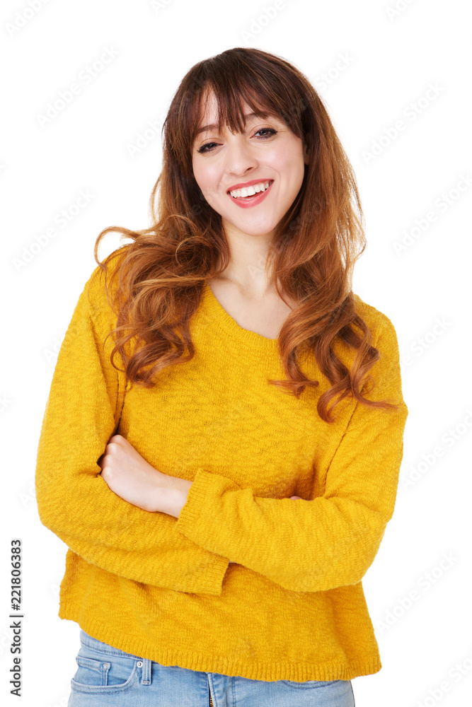 young woman smiling with arms crossed against isolated white background young woman smiling with arms crossed against isolated white background