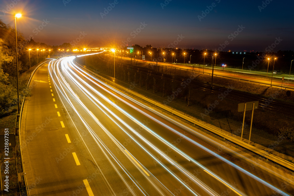  light trails on motorway highway at night, long exposure