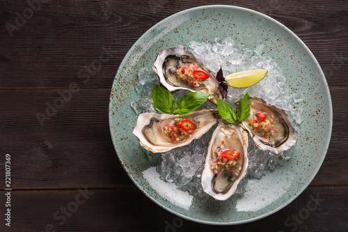 Open oyster stuffed with papper and lemon