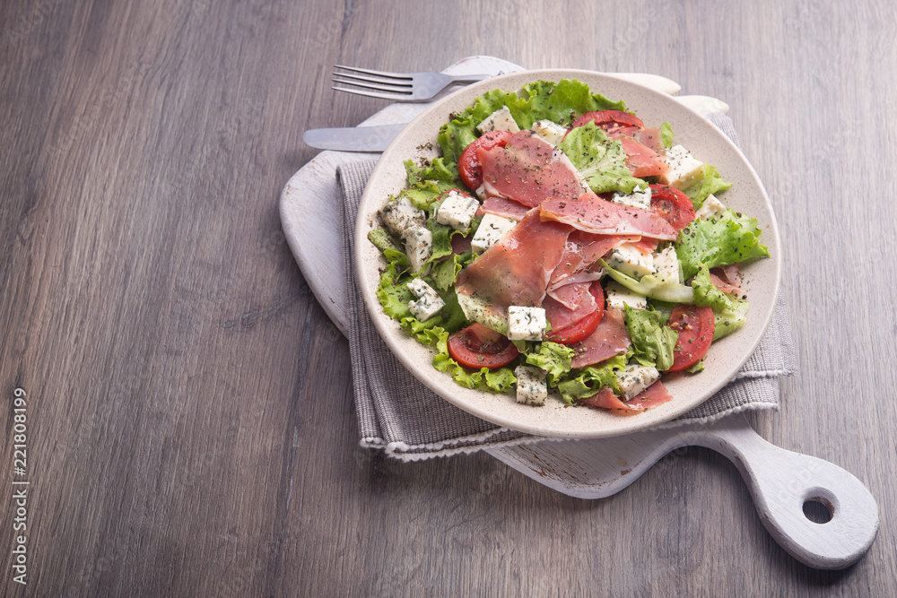 Fresh salad with hamon, tomato, lettuce and cheese blue Fresh salad with hamon, tomato, lettuce and cheese blue