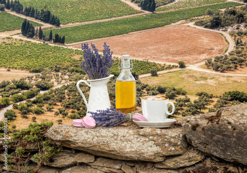Fototapeta Naklejka Na Ścianę i Meble -  Lavender still life with cup of coffee against fields in Provence, France