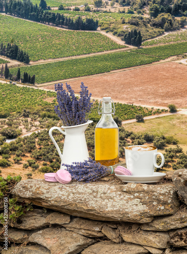 Fototapeta Naklejka Na Ścianę i Meble -  Lavender still life with cup of coffee against fields in Provence, France