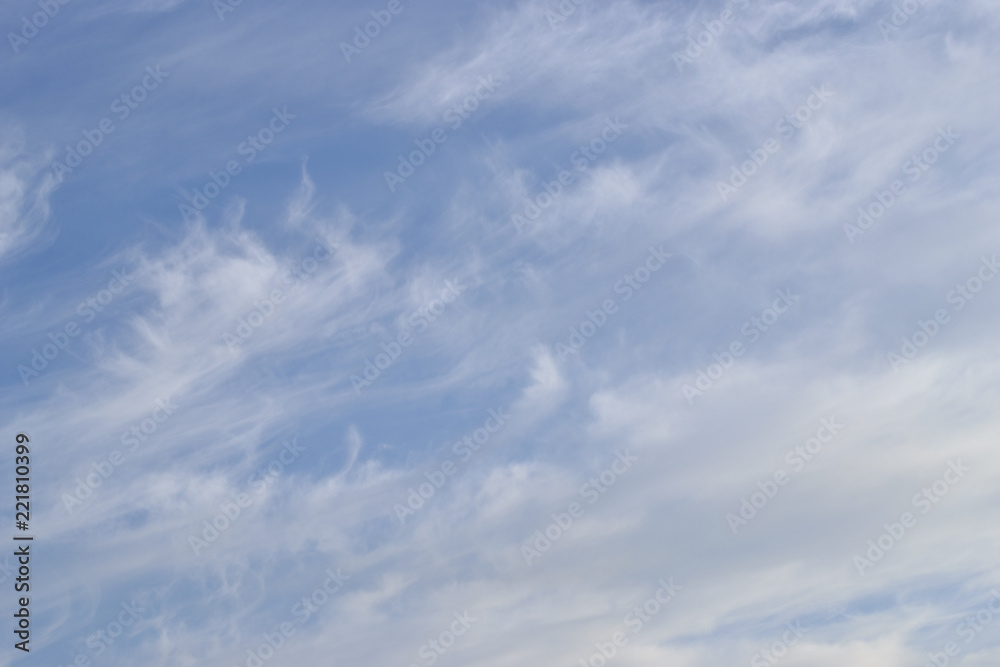 Cloudy sky in summer. Background.
Light white clouds in the blue sky.