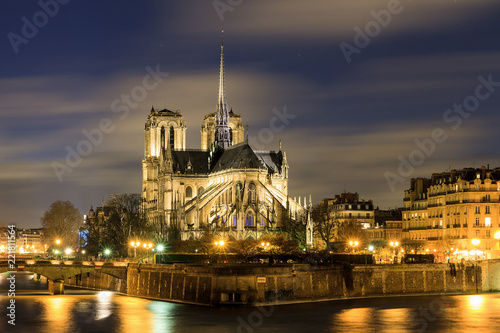 Beautiful view of the river Seine with the Notre-Dame Cathedral in Paris at night © dennisvdwater