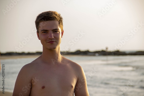 Retro photo of a young attractive man on the background of the sea