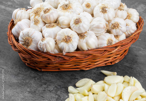 Pile of Fresh Organic Garlic on Vintage Wooden Background photo