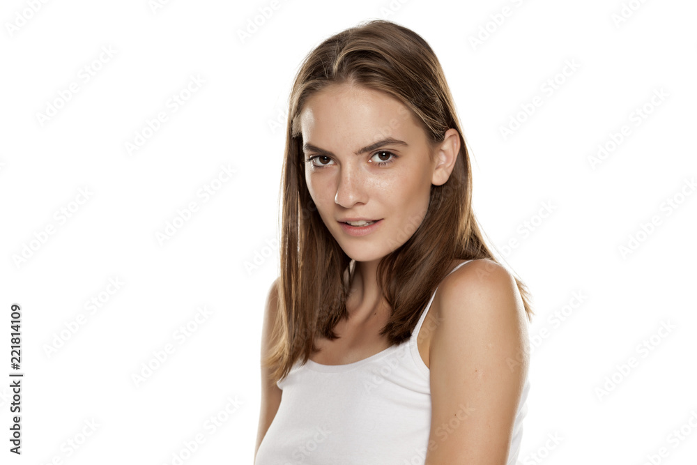 Portrait of young beautiful woman with no makeup on white backgeound Portrait of young beautiful woman with no makeup on white backgeound