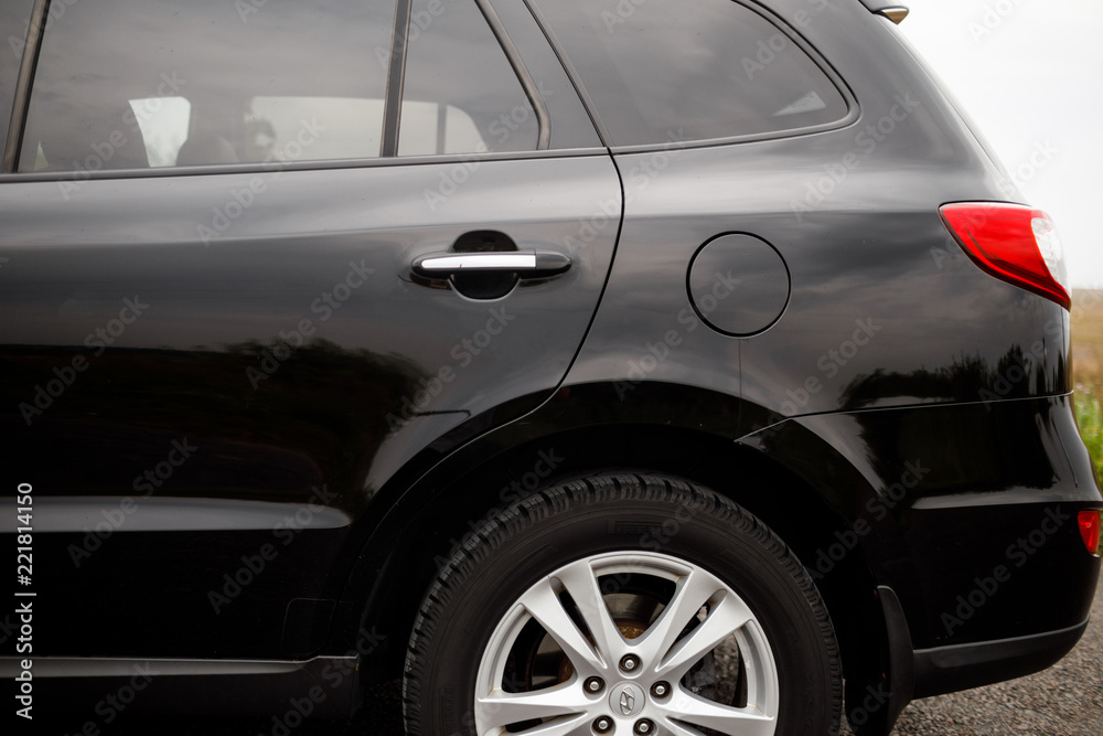 Black modern car closeup. Black modern car headlights - front vi