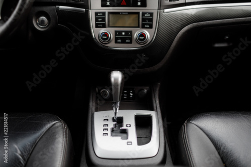 Modern luxury prestige car interior, dashboard, steering wheel.