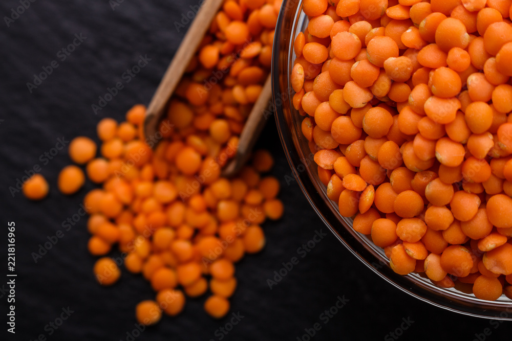 raw lentils on a dark stone background raw lentils on a dark stone background