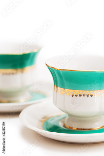 set of dishes on white background. Green indian cups