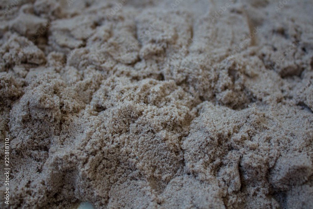 the grey sand scattered on the table the grey sand scattered on the table