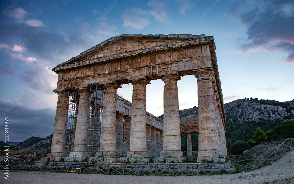 The ruins of the Greek temple at sunset in the ancient city of Segesta, Sicily, Italy