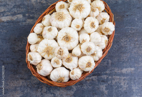 Pile of Fresh Organic Garlic on Vintage Wooden Background photo