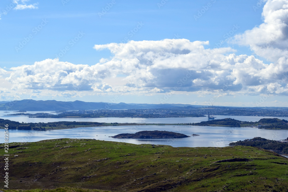 View from the top of the hill. The nature of Norway. The island of Rennesoy.View of the sea. Blue sky. Sunny day.