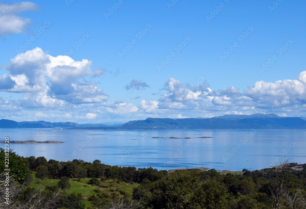 View from the top of the hill. The nature of Norway. The island of Rennesoy.View of the sea. Blue sky. Sunny day.