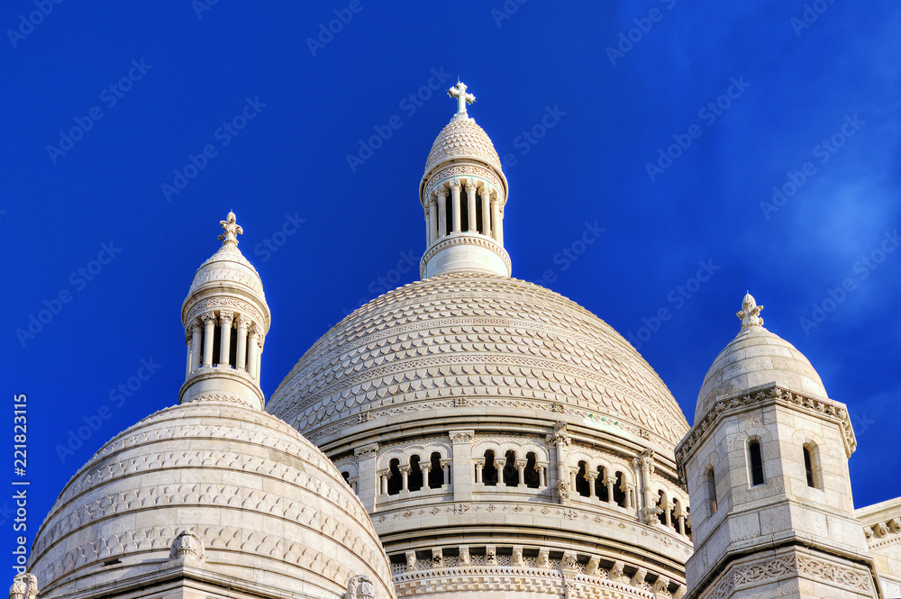 Beautiful view of the dome of the Sacre-Coeur in Paris with a blue sky Beautiful view of the dome of the Sacre-Coeur in Paris with a blue sky