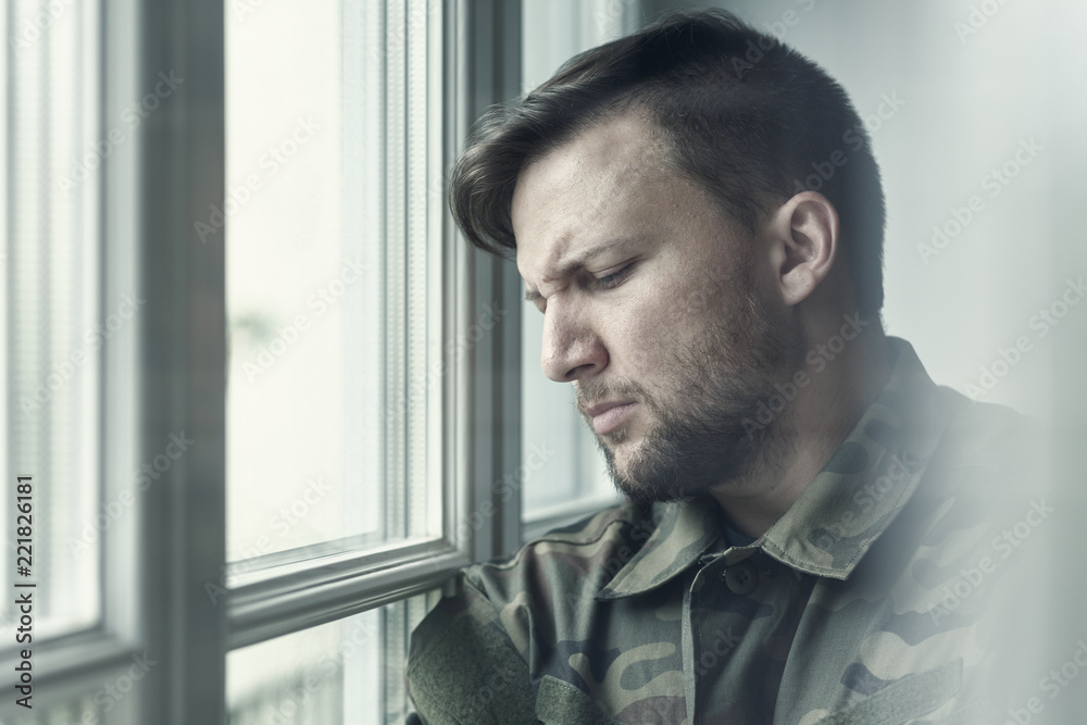 Sad and lonely soldier in depression after war with emotional problem