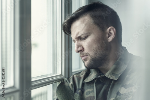 Sad and lonely soldier in depression after war with emotional problem