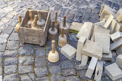 Stonemason tools hammer and chisel outdoors.