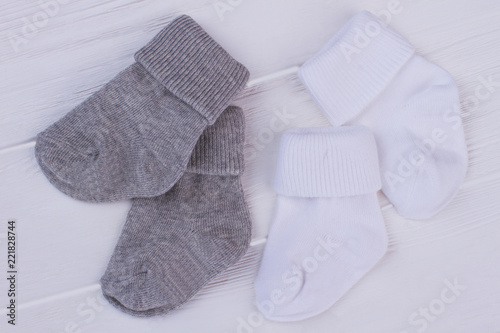 Two pairs of grey and white socks.