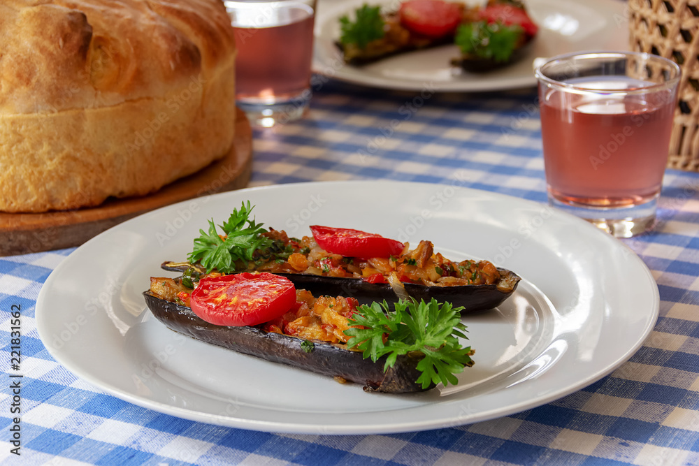 eggplant stuffed with vegetables on a plate eggplant stuffed with vegetables on a plate