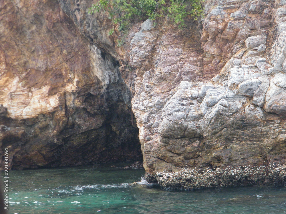 Rock and sea with small sea wave.