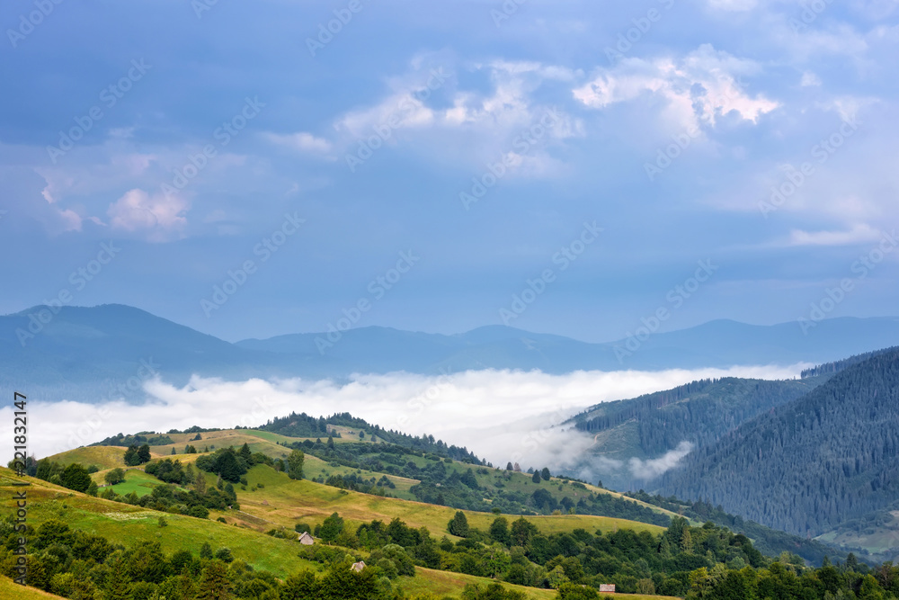 Beautiful rural mountain landscape with fog in the valley.  Carpathian, Ukraine, Europe.