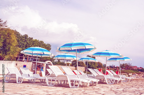 umbrellas and sun loungers on the beautiful European beach