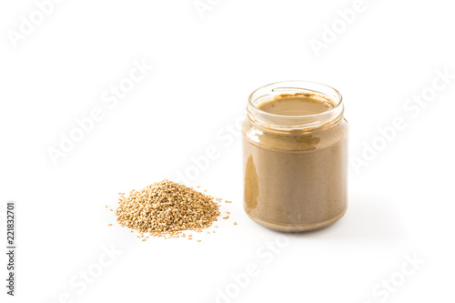 Tahini and sesame seeds isolated on white background

