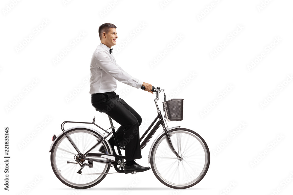 Young man in a tux riding a bicycle Young man in a tux riding a bicycle