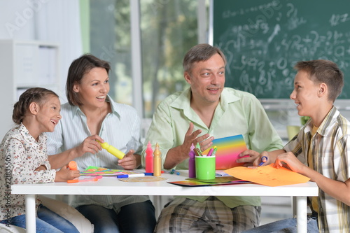 Portrait of Happy family drawing at home