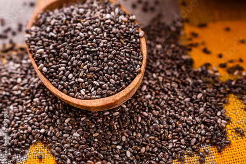 chia seeds on a light rustic background © Narsil