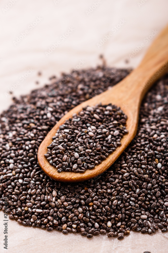 chia seeds on a light rustic background chia seeds on a light rustic background