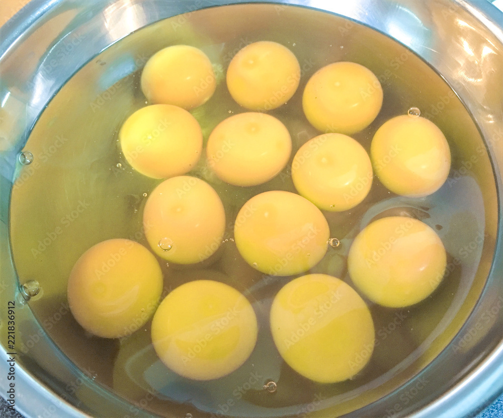 Raw liquid eggs in the mixing bowl. Raw liquid eggs in the mixing bowl.