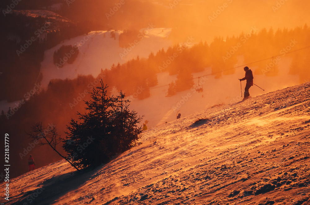 Silhouette of a skier on the hill. Sport and active life