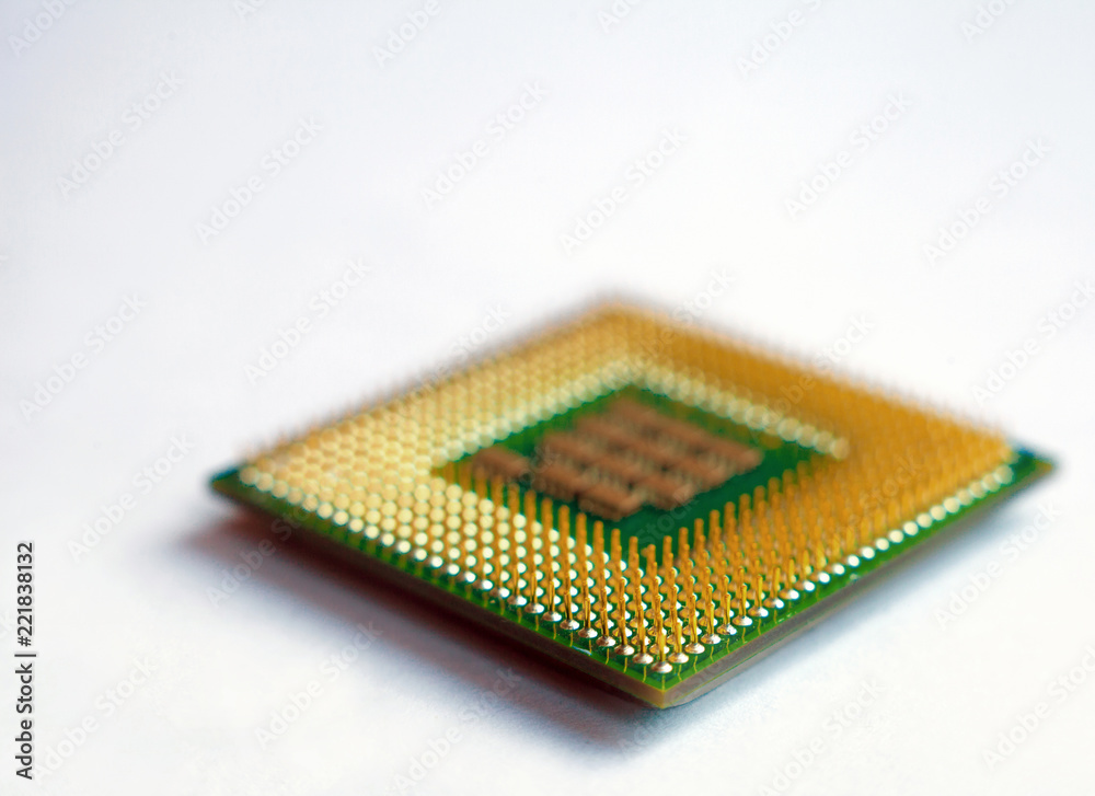 Isolated closeup microprocessor cpu lying on white table Isolated closeup microprocessor cpu lying on white table