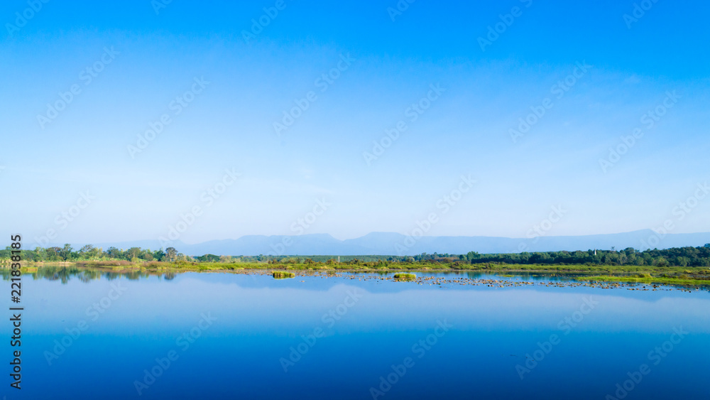 Scenic View Of Lake Against Blue Sky. Beautiful Landscape.