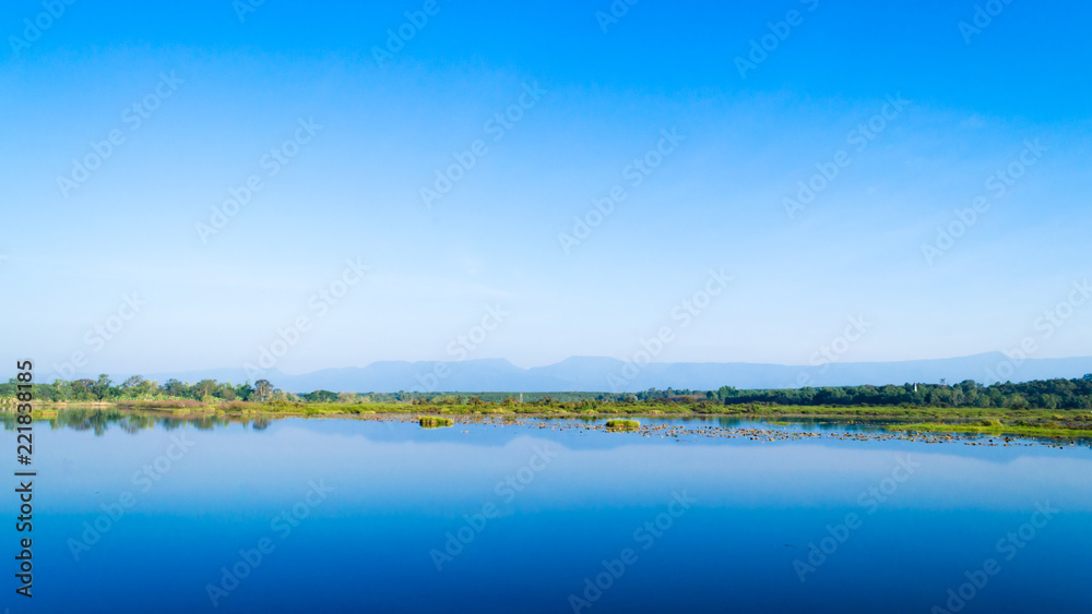 Scenic View Of Lake Against Blue Sky. Beautiful Landscape.