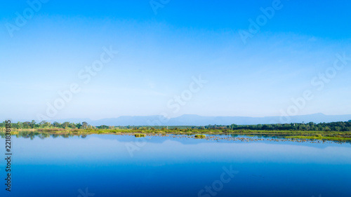 Scenic View Of Lake Against Blue Sky. Beautiful Landscape.